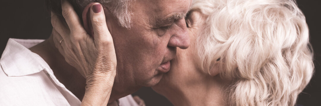 Kissing husband tenderly