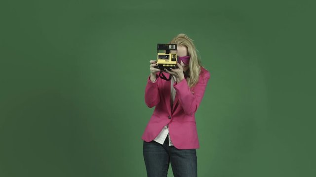 caucasian woman pink jacket isolated on chroma green screen background camera photography polaroid