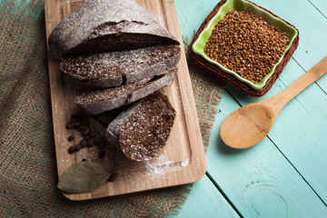 Tasty rustic bread on wooden table