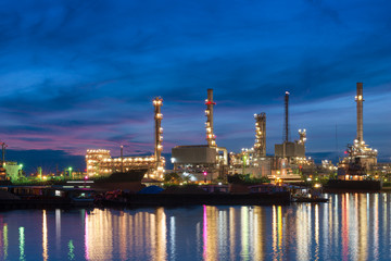 Oil Refinery with blue sky in early morning in Bangkok, Thailand. Concept of Power and Fuel, heavy industry and environment.