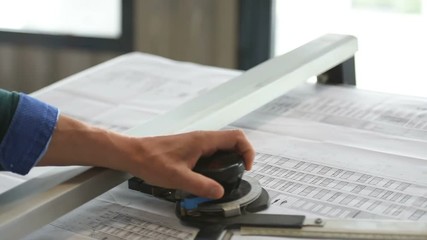 Architect designing on drawing table