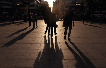 Shadows of people walking in a street of the city at the sunset, Athens, Greece. - 111471275
