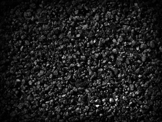 Black sand grunge background. Сlose-up.