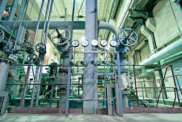 Equipment, cables and piping as found inside of a modern industr