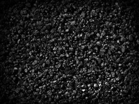 Black sand grunge background. Сlose-up.