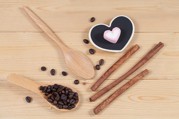 strong roasted coffee beans on grunge  wood background