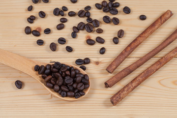 strong roasted coffee beans on grunge  wood