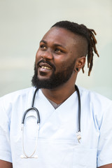 Portrait of african american doctor with beard and stethoscope around his neck