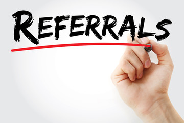 Hand writing Referrals with red marker, business concept