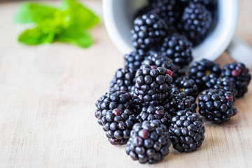Blackberries on a wooden table. Selective focus. Close-up view.