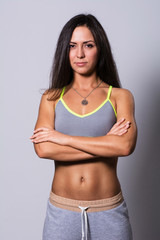 Fototapeta premium Beautiful young sporty muscular woman