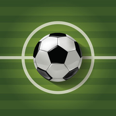 Obraz premium Vector A soccer ball on a green stripped soccer filed texture.