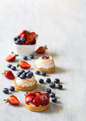 Fresh berry tarts with strawberry and blueberry 