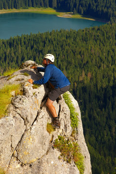 Climbing Tourist with Lake of Crno Jezero on Background, Durmitor, Montenegro