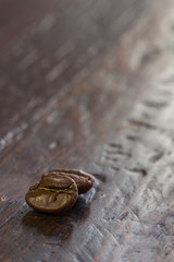 Coffee beans on wood background
