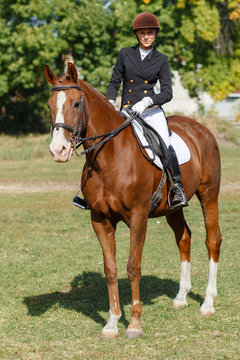 Young teenage girl riding horse. Equestrian sport