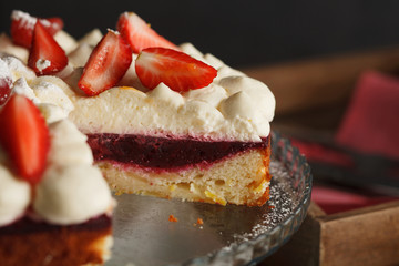 Tart with strawberries and cherry and whipped cream