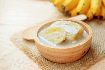 banana in coconut milk with ripe yellow banana. traditional thai dessert made from Pisang Awak banana