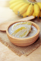 banana in coconut milk with ripe yellow banana. traditional thai dessert made from Pisang Awak banana