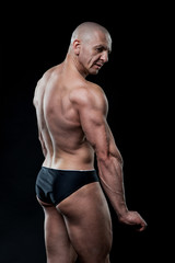 Fototapeta na wymiar bodybuilder, bodybuilding, sports, background, black, studio