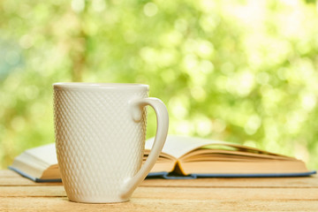 Cup and opened book