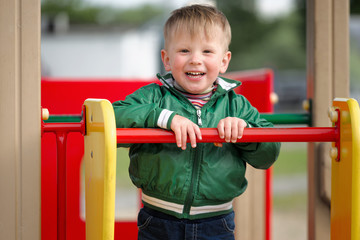 children play on the playground. early spring