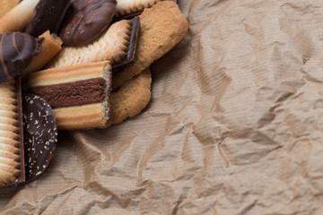 Cookies assorted on black background. Delicious morning snacks for breakfast, brunch and lunch. Appetizing, sweet and fast food.