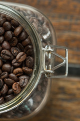 Coffee beans on wood background