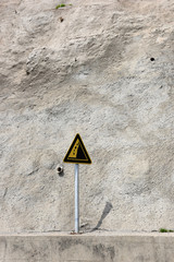 Landslide warning, certainly reasonable, with fallen rocks around.
