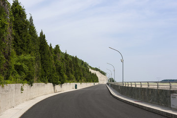Driving on the long Road in nature.