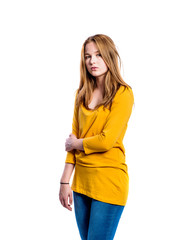 Girl in jeans and t-shirt, young woman, studio shot