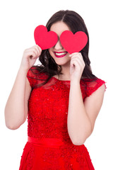 portrait of happy woman in red dress covering eyes with two pape