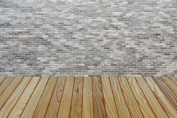 Wood table top on brick wall background