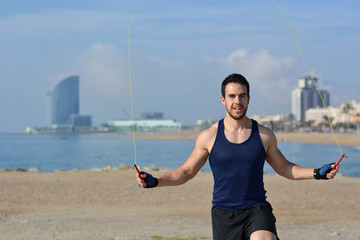 Athlete jumping rope in the city