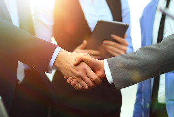 Business handshake in office