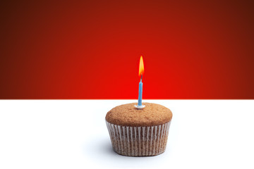 festive muffin with a candle
