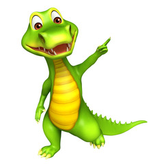 Fototapeta premium cute Aligator cartoon character pointing towards blanck space