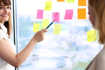 business team working  with  stickers in office, woman showing t
