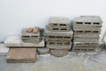 Keeping leftover building materials after construction. It also can be used as a concept of waste; recycle or saving.