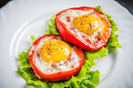 eggs on a green salad in a red pepper, food