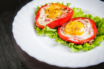 eggs on a green salad in a red pepper, food