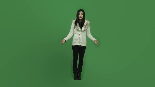 Asian girl young adult isolated greenscreen green background upset talking interview