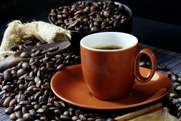 Red coffee cup and coffee beans