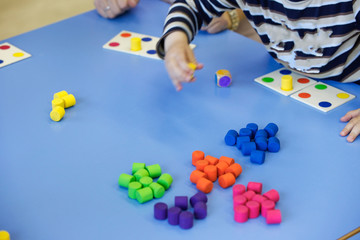 Children playing with homemade educational toys