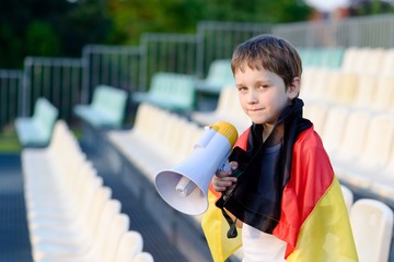 Germany fan screaming through megaphone on the stadium