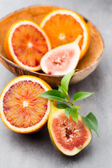 Bloody Sicilian oranges and figs. Shallow depth of field.