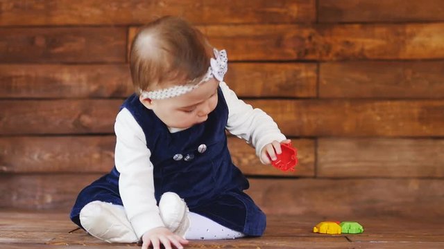 Little girl playing with color toys