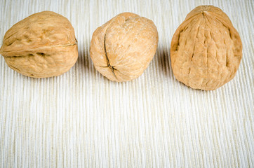 walnut on table cloth, close up.
