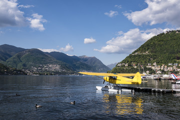 Beautiful Lake Como and Sea Plane: A spring time view of beautiful Lake Como with a yellow sea plane and ducks on the water - 111498284
