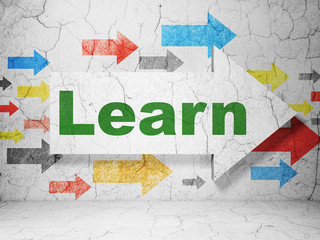 Learning concept: arrow with Learn on grunge wall background